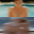 Naked woman giving oral